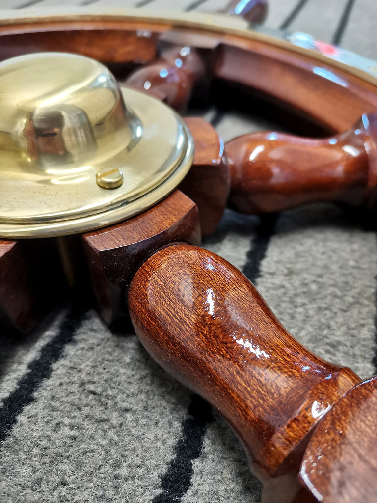 close up of mahogany wood on mahogany steering wheel